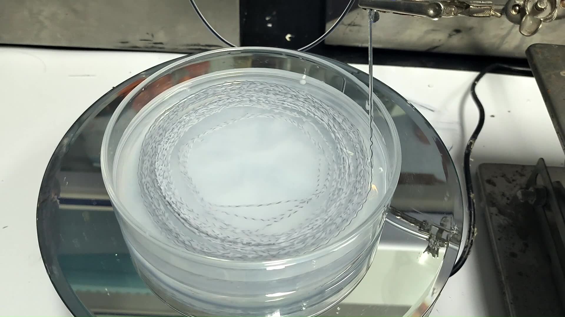Strain-Insensitive Stretchable Conductive Fiber Based on